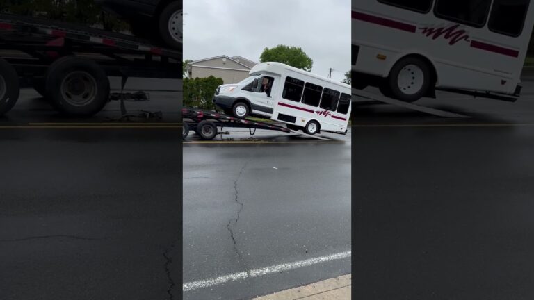 Driving the bus onto the tow truck! Very Skilled Tow Truck Driver!